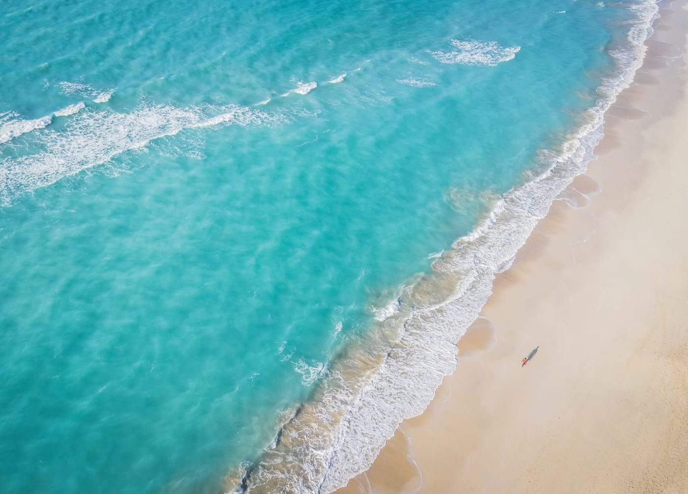 Saadiyat Island from above. The Saadiyat Cultural District includes the Louvre Abu Dhabi and the under-construction Guggenheim Abu Dhabi, anchoring the cultural-economy programme that ADQ's Sotheby's stake operationally extends.