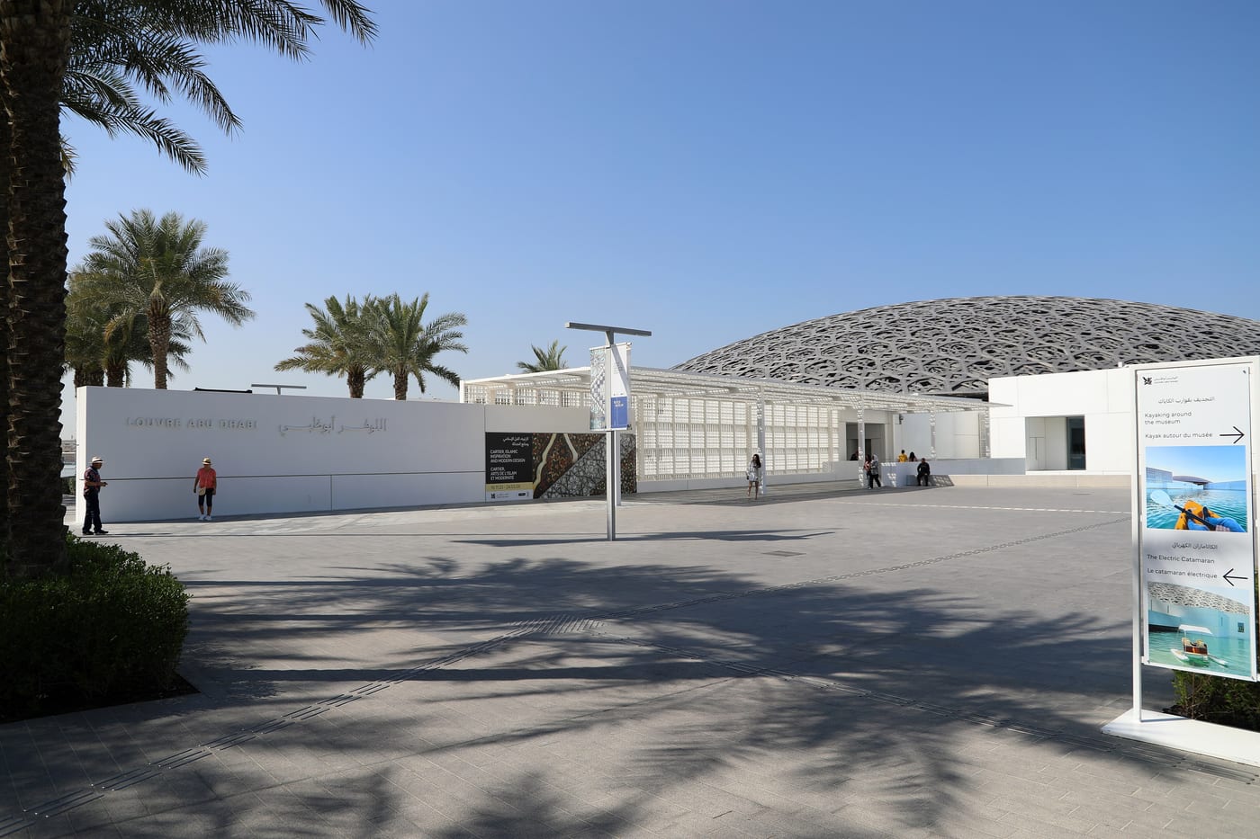 The Louvre Abu Dhabi by Jean Nouvel. The perforated geometric dome and the reflecting water around the Saadiyat Cultural District museum that opened in 2017 and now sits alongside ADQ's 2024 minority stake in Sotheby's as the visible Abu Dhabi cultural-economy programme.
