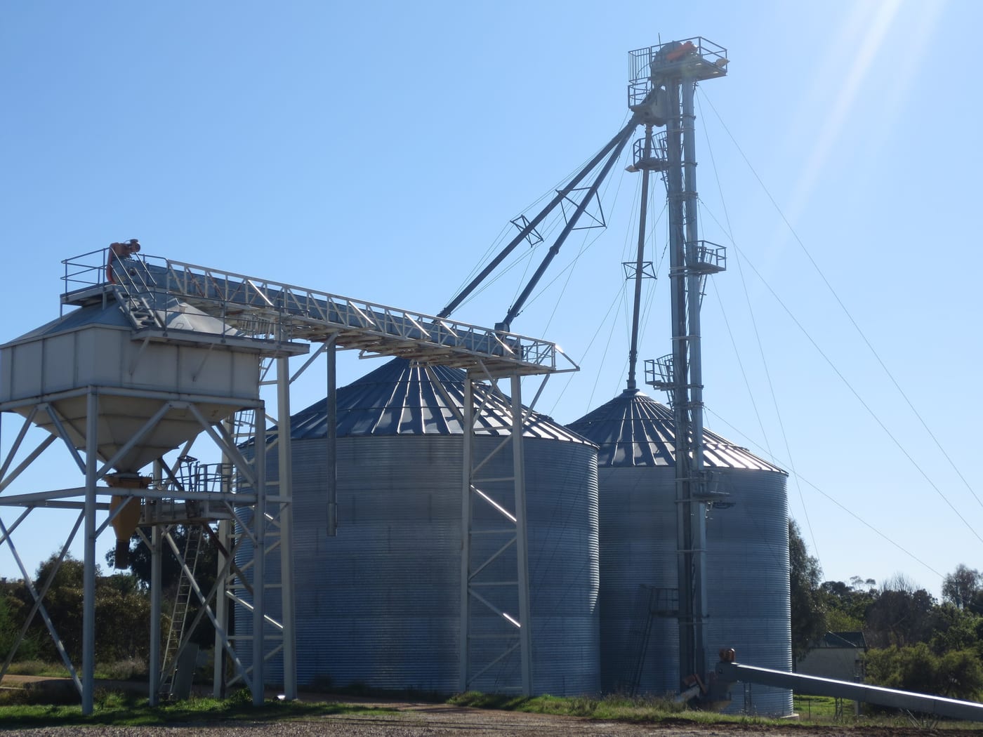 A line of grain silos. The storage-and-elevator infrastructure that Cargill operates at scale across the US Midwest and globally is one of the structural moats of the family business.