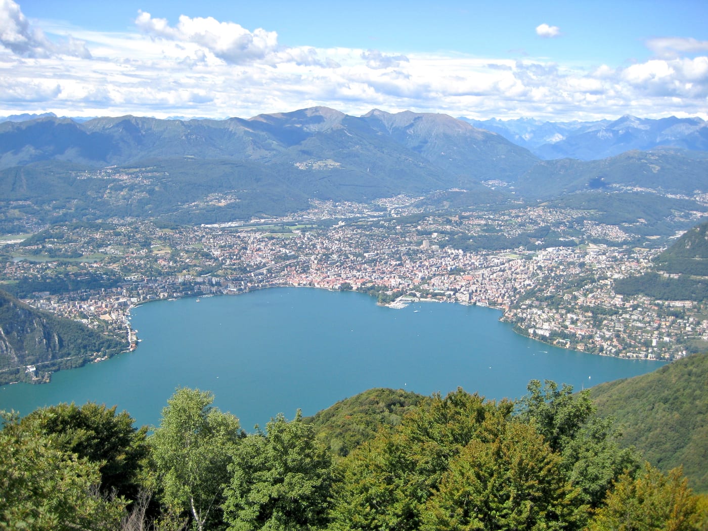 Lugano viewed from Sighignola in Italian-speaking Switzerland (Ticino canton). One of the four Swiss cantons that absorbs the bulk of the Swiss forfait fiscal applicants.