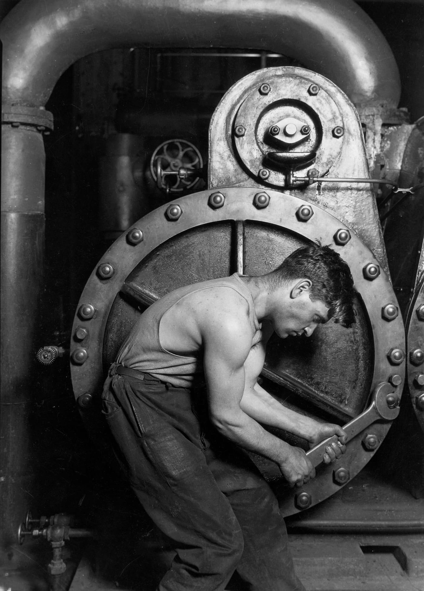 Lewis Hine's Power House Mechanic Working on Steam Pump (1920). One of the earliest American interpretive industrial photographs. The kind of vintage gelatin silver image whose secondary market the 2025 to 2026 Phillips photography results materially deepened.