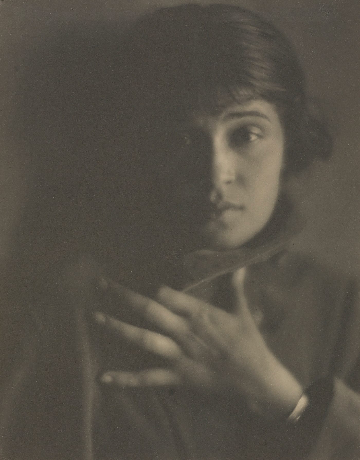 Tina Modotti photographed by Edward Weston, c. 1923-24. Modotti the protagonist of Phillips' April 2026 photographs sale catalogue, here in Weston's vintage gelatin silver portrait. The face behind the lens whose Mexican-period work led the modern photography market in 2026.